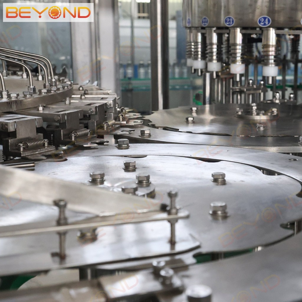 Starwheel and numbered filling heads on Beyond water filler
